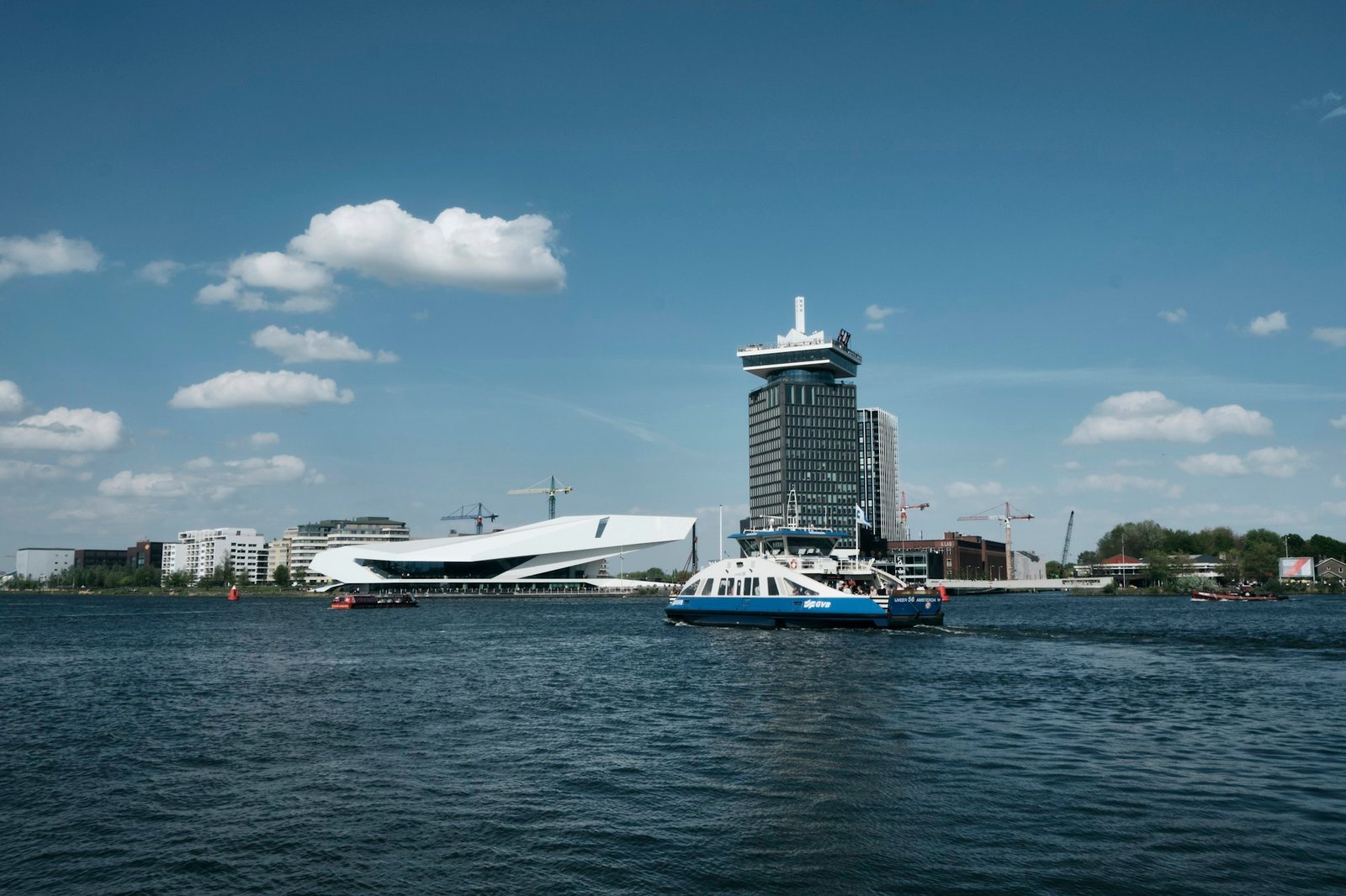 Ferry crossing the IJ waterfront near the EYE Film Museum, Amsterdam Noord