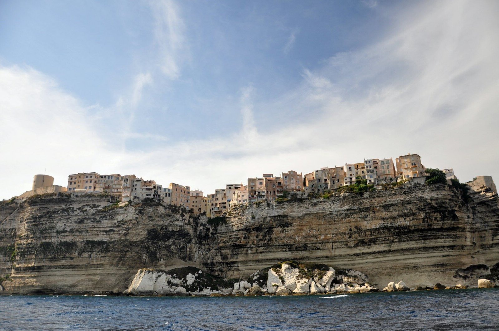Bonifacio old town on white limestone cliffs seen from the sea