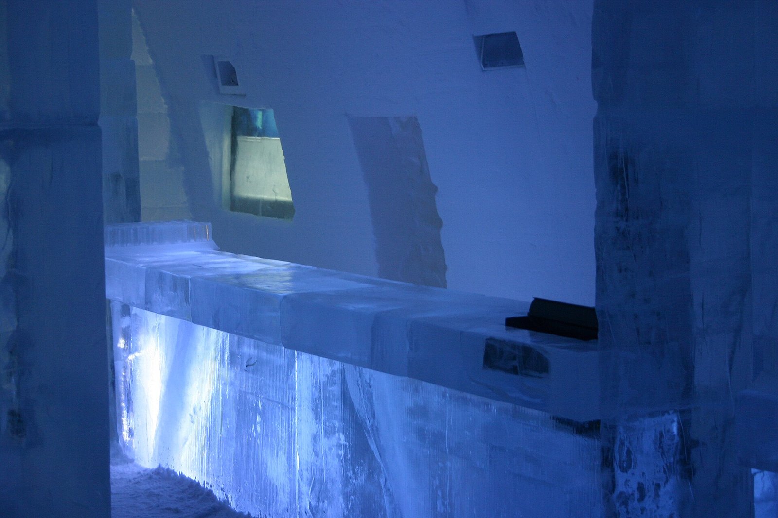 Bar counter carved from ice and lit from within, ICEHOTEL Jukkasjarvi