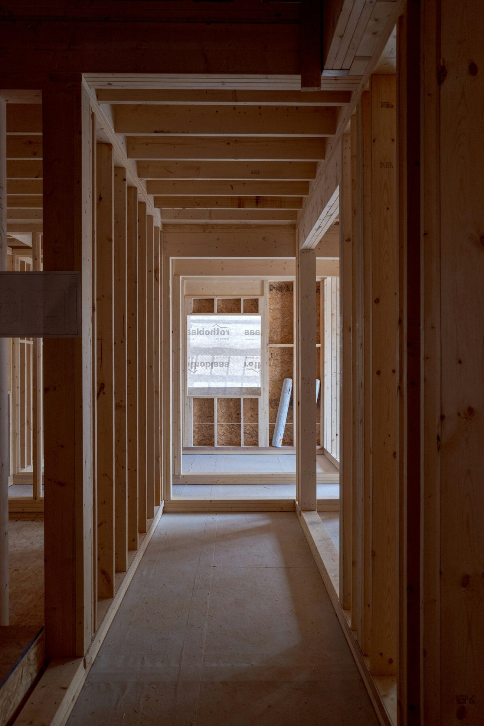 Interior of a traditional wooden cabin, exposed beams and simple furnishings